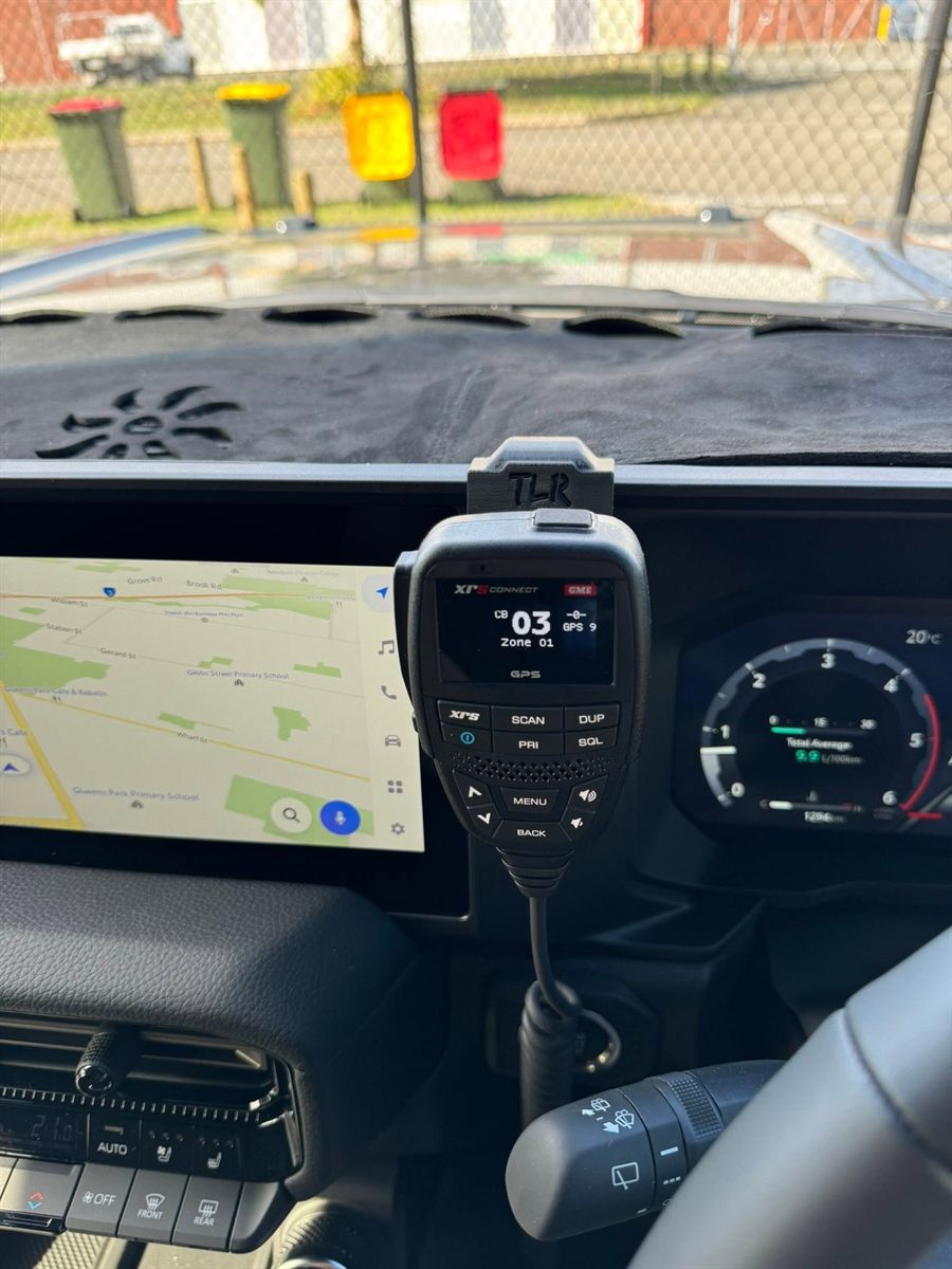 GME XRS Connect UHF radio handset mounted on a dash bracket