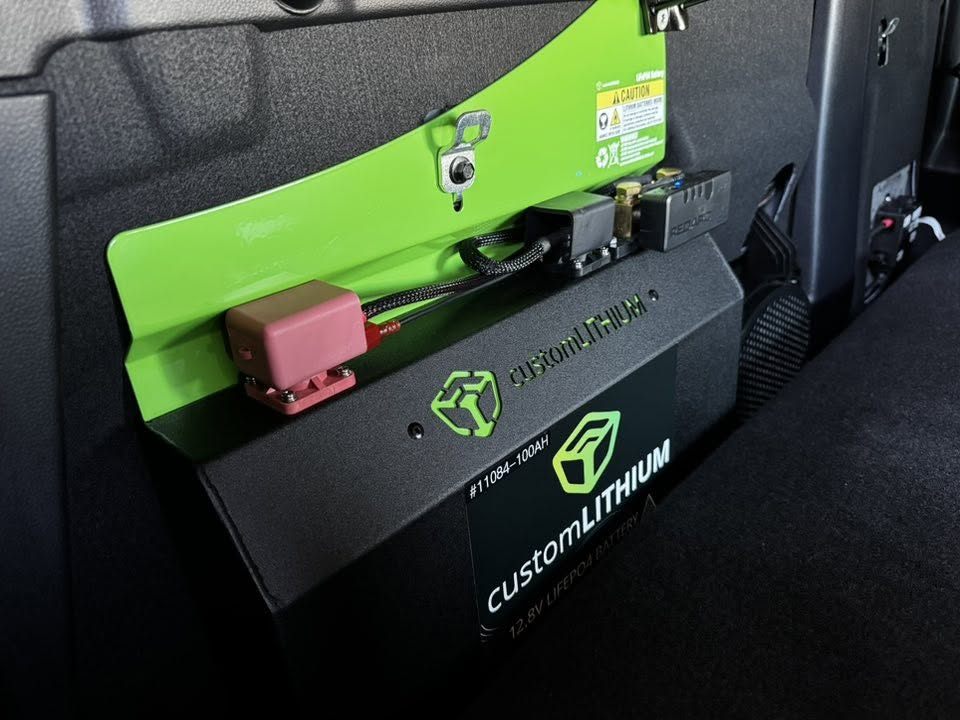 Custom Lithium 100Ah lithium battery on a custom side-panel bracket with a REDARC isolator