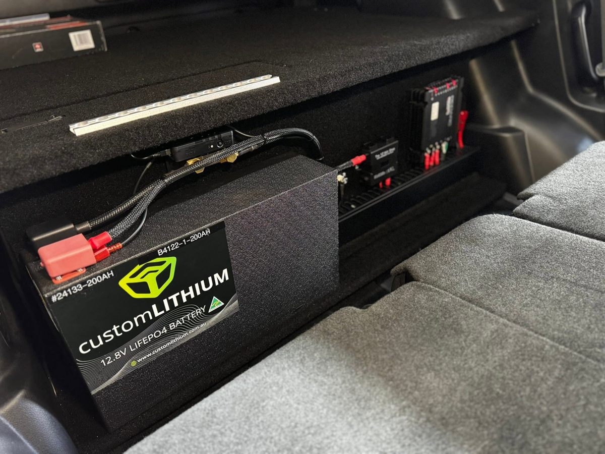 Custom Lithium 200Ah lithium battery and REDARC BCDC charger installed under a rear drawer system