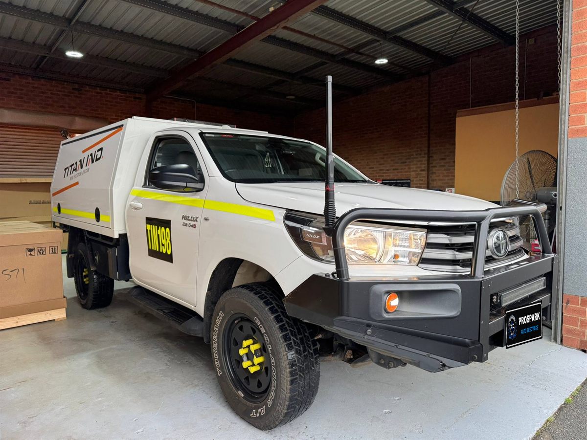 Hilux service-body ute with bullbar and UHF antenna