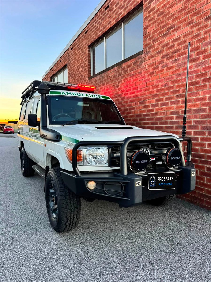 Ambulance LandCruiser with STEDI driving lights and a red roof light bar