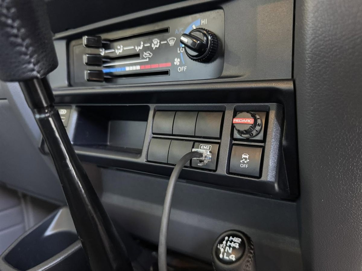 REDARC brake controller fitted in a LandCruiser switch panel